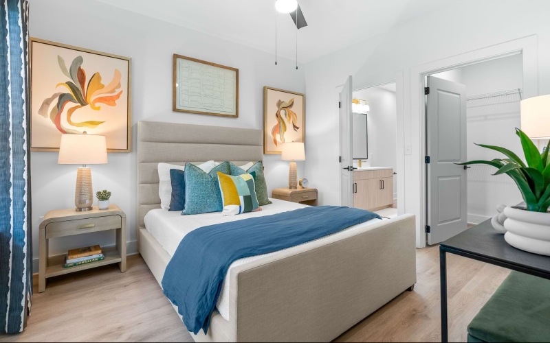 A bedroom with a closet and bathroom