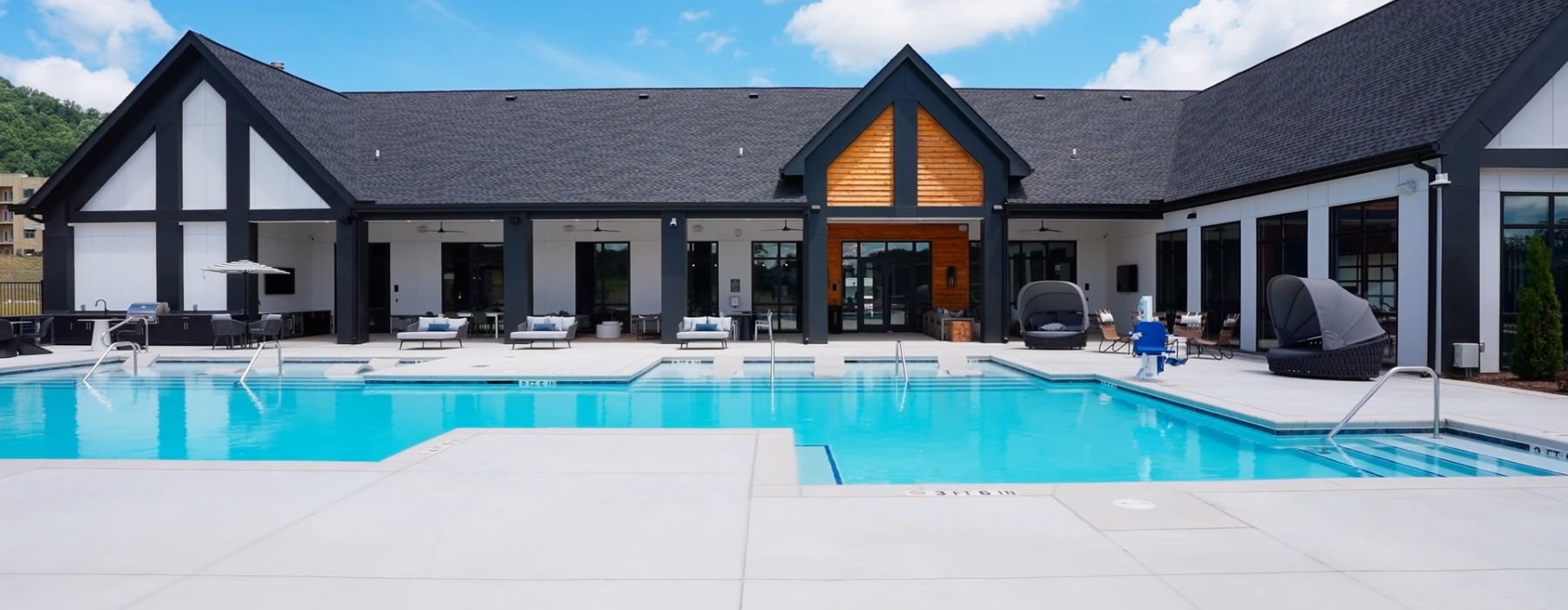 a swimming pool with a building in the background