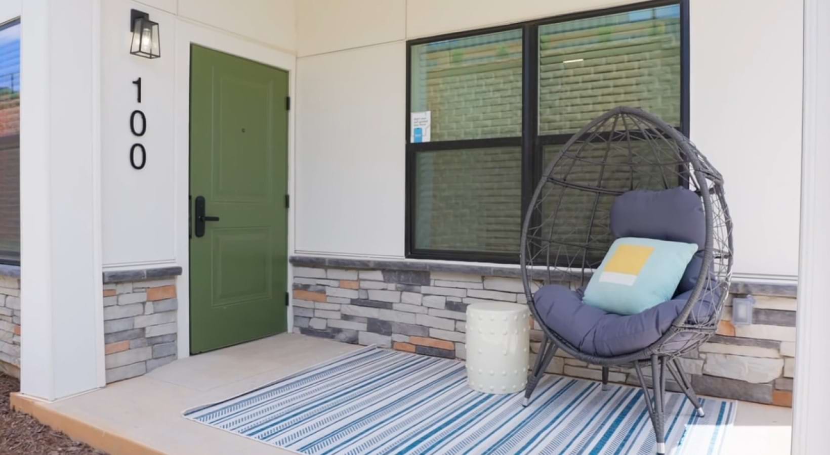 a porch with chair and table